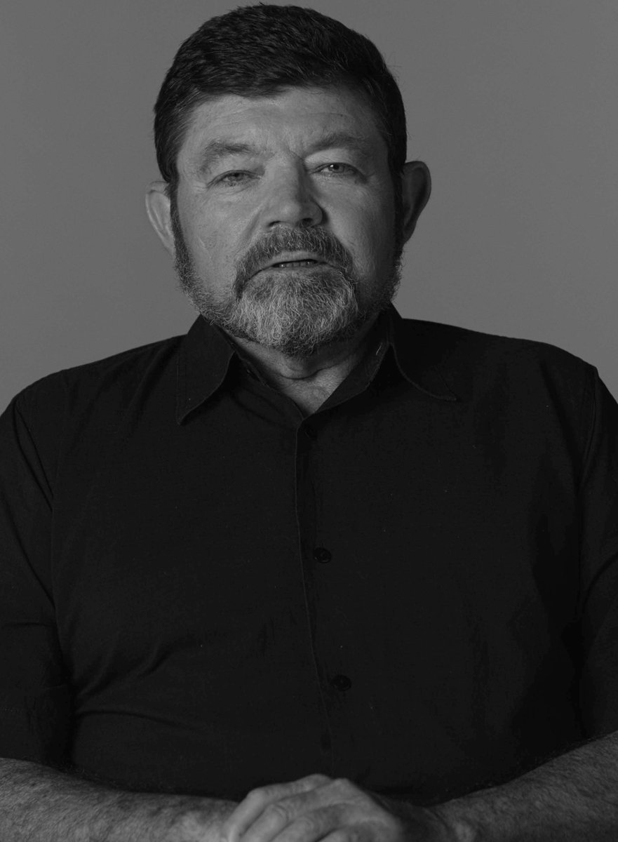 A black and white portrait of filmmaker bob Connolly