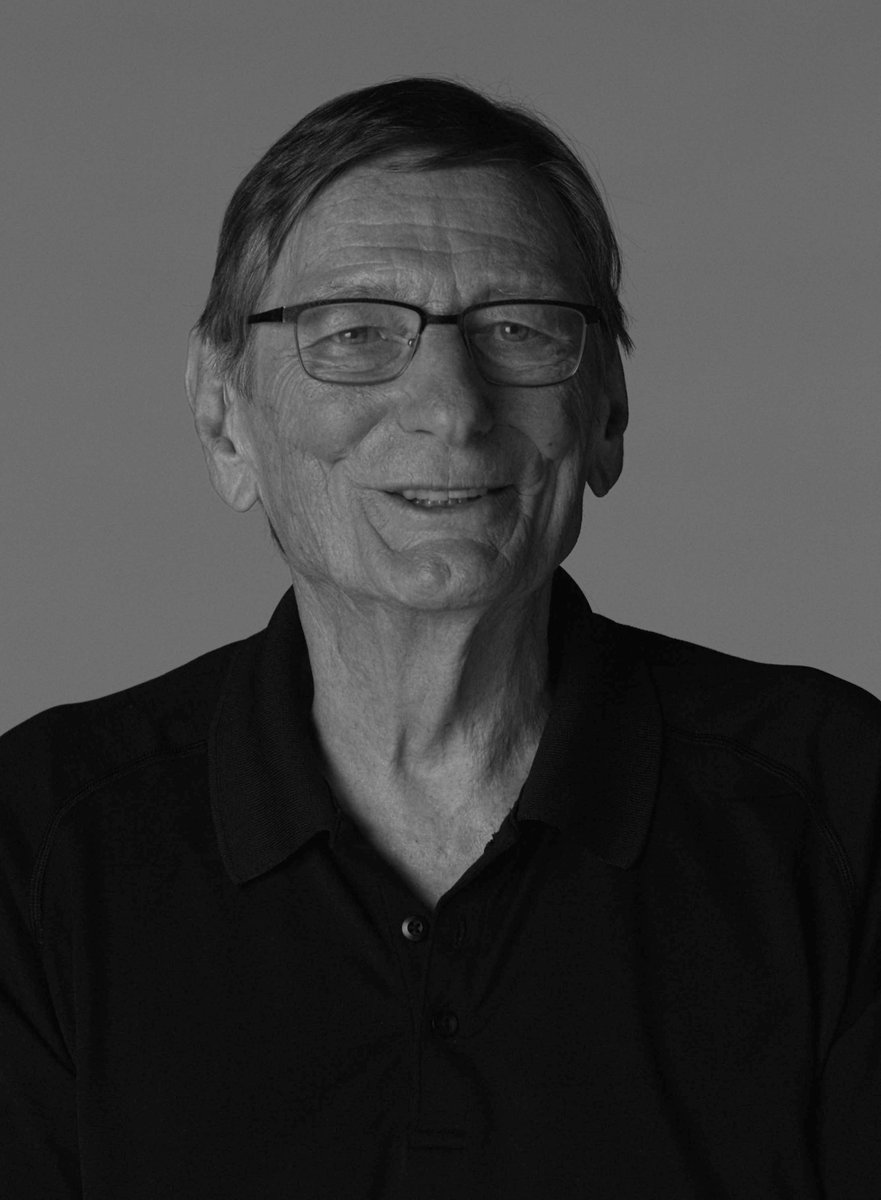 A black and white portrait of director Fred Schepisi