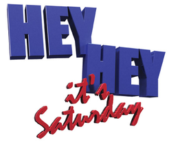 The logo for Hey Hey Its Saturday, with hey hey in block blue letters and saturday in red cursive script