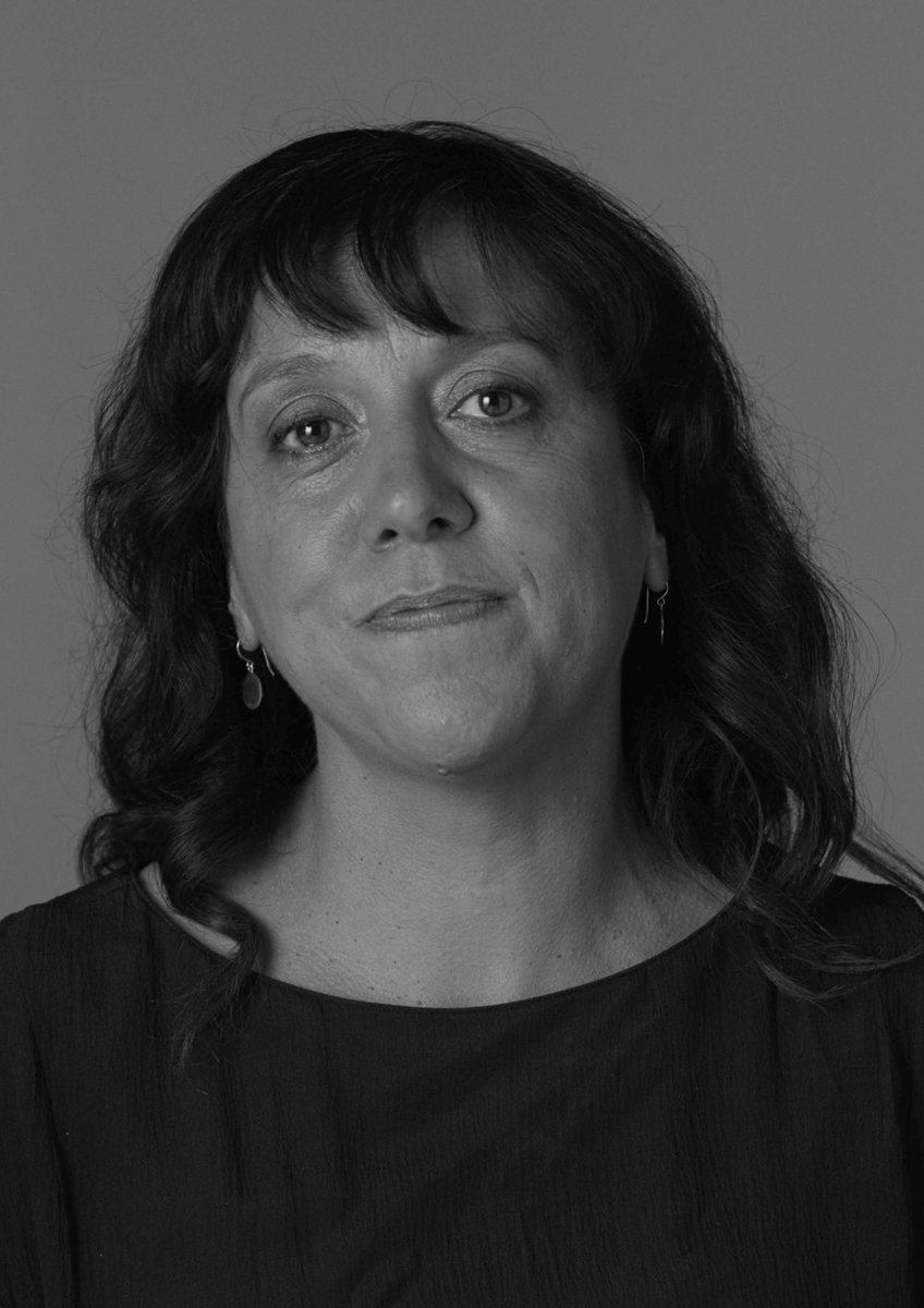 A black and white portrait of Rachel Perkins