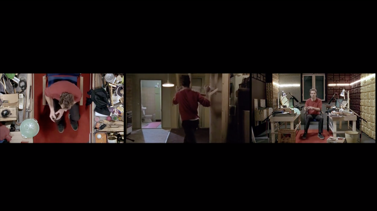 A three channel video work that features three sgements of a man in a red shirt and grey pants making different sound effects in the three different screens
