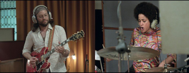 An split screen image of a man with long hair playing the guitar juxtaposed with a woman playing drums, she has an afro. They're both dressed in 70s attire.