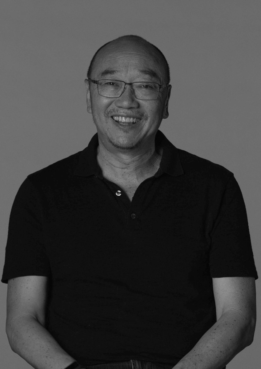 A black and white portrait of Tony Ayres