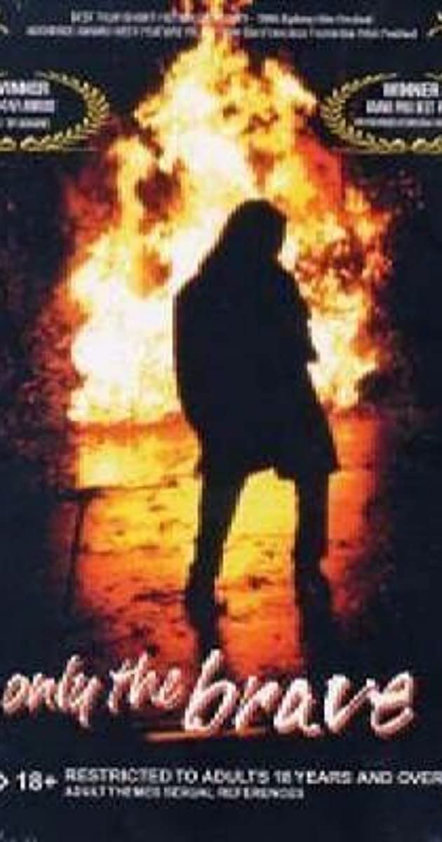 a movie poster of a woman's silhouette on a black background with fire surrounding her