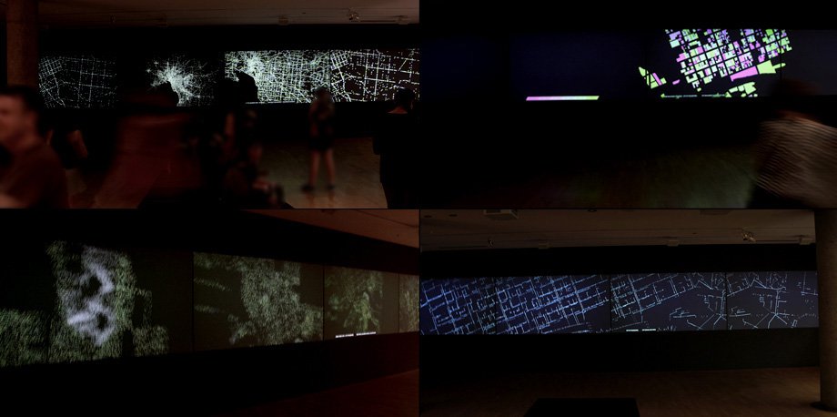 An image of a wall of black screen with illuminated lights and data streams representing different aspects of the Melbourne city