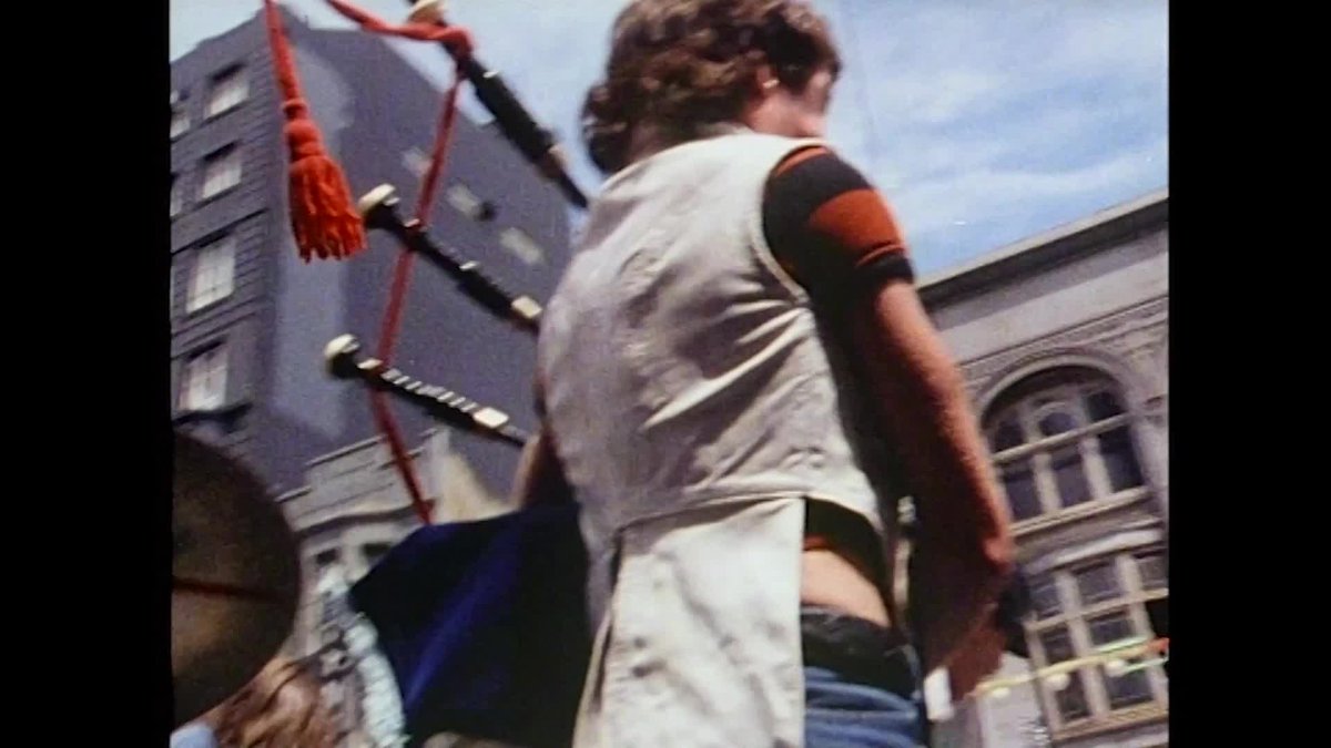 A blurry image of the band AC/DC playing on Melbourne streets