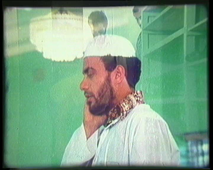 A still image from Living in Two Worlds