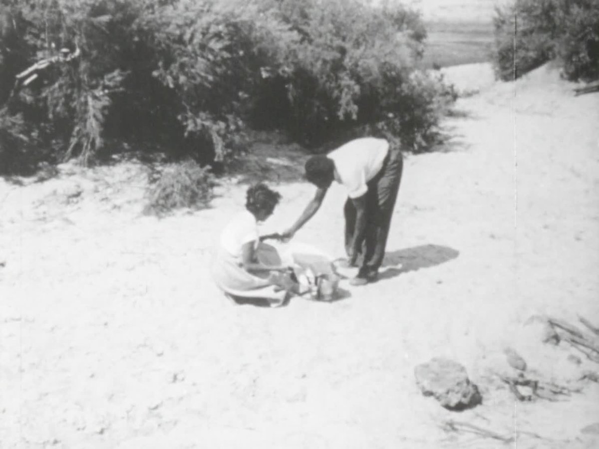 A still image from Lily feeds a baby